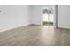 Bright living room with tile floors and sliding glass door leading to backyard at 3673 Portsmouth Ln, Haines City, FL 33844