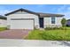 Two-car garage and a well-maintained lawn at 2482 Leeds St, Haines City, FL 33844