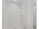 Clean shower with tile surround and glass door at 2482 Leeds St, Haines City, FL 33844