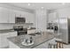 Spacious kitchen with granite island and stainless steel appliances at 2482 Leeds St, Haines City, FL 33844