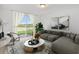 Relaxing living room with comfy sectional sofa and sliding glass doors at 2482 Leeds St, Haines City, FL 33844