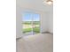 Bright bedroom with sliding glass door to backyard at 2482 Leeds St, Haines City, FL 33844