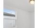 Simple bedroom with a window and light-colored walls at 2482 Leeds St, Haines City, FL 33844