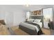 Cozy bedroom with large bed, neutral tones, and artwork at 2482 Leeds St, Haines City, FL 33844