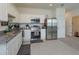 Modern kitchen with stainless steel appliances and granite countertops at 190 Mandovi St, Davenport, FL 33837
