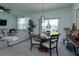 Casual dining area with table and chairs, looking out to backyard at 190 Mandovi St, Davenport, FL 33837