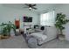 Cozy living room featuring a comfy sectional sofa and a modern fireplace at 190 Mandovi St, Davenport, FL 33837