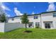 Two-story home exterior, white siding and backyard at 190 Mandovi St, Davenport, FL 33837
