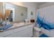 Charming bathroom with a mermaid-themed shower curtain and updated vanity at 190 Mandovi St, Davenport, FL 33837