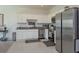 Modern kitchen with stainless steel appliances and granite countertops at 190 Mandovi St, Davenport, FL 33837
