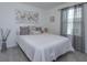 Bright bedroom with a comfortable bed and stylish decor at 190 Mandovi St, Davenport, FL 33837