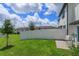 Private backyard with grassy area and patio at 190 Mandovi St, Davenport, FL 33837