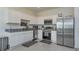 Modern kitchen with stainless steel appliances and granite countertops at 190 Mandovi St, Davenport, FL 33837