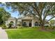 Exterior of charming two-story home with landscaping at 1560 Eagle Nest Cir, Winter Springs, FL 32708