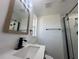 Clean bathroom featuring a vanity with a modern faucet and shower at 111 Lake Dot Dr, Sanford, FL 32773