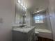 Updated bathroom with marble vanity and a bathtub at 111 Lake Dot Dr, Sanford, FL 32773