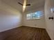 Well-lit bedroom with wood-look floors and a ceiling fan at 111 Lake Dot Dr, Sanford, FL 32773
