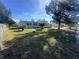 House exterior, featuring a green lawn and trees at 111 Lake Dot Dr, Sanford, FL 32773