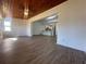 Spacious living area with wood-look floors and kitchen view at 111 Lake Dot Dr, Sanford, FL 32773