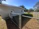 Side yard with chain link fence and gate at 111 Lake Dot Dr, Sanford, FL 32773
