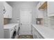 Bright laundry room with ample counter space at 2092 Rocky Bluff Ct, Oviedo, FL 32765