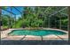 Relaxing screened pool and spa with brick pavers and lush landscaping at 2092 Rocky Bluff Ct, Oviedo, FL 32765