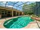 Relaxing pool area with a screened enclosure and plenty of space for lounging at 2092 Rocky Bluff Ct, Oviedo, FL 32765