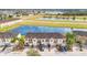 Aerial view of townhouses near a lake at 3466 Allegra Cir, Saint Cloud, FL 34772