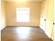 Spacious bedroom with large window and wood-look flooring at 366 Fairfield Dr, Sanford, FL 32771