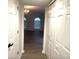 Hallway with double closets and view into living room at 366 Fairfield Dr, Sanford, FL 32771