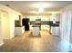 Spacious kitchen with white cabinets, island, and granite countertops at 366 Fairfield Dr, Sanford, FL 32771