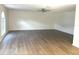 Large living room with light wood floors and a ceiling fan at 366 Fairfield Dr, Sanford, FL 32771