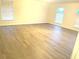 Spacious living room featuring wood-look floors and ample natural light at 366 Fairfield Dr, Sanford, FL 32771