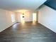 Spacious living area with wood-look floors and a chandelier at 366 Fairfield Dr, Sanford, FL 32771