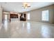 Open living room with tile flooring, high ceilings and kitchen access at 8851 Sperry St, Orlando, FL 32827