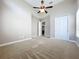 Spacious bedroom with high ceilings and ceiling fan at 8851 Sperry St, Orlando, FL 32827