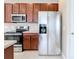 Modern kitchen with stainless steel refrigerator and microwave at 8851 Sperry St, Orlando, FL 32827