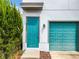 Teal front door with a single garage door to the side at 8851 Sperry St, Orlando, FL 32827