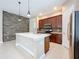 Modern kitchen with an island, stainless steel appliances, and dark wood cabinets at 8851 Sperry St, Orlando, FL 32827