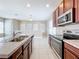 Kitchen with stainless steel appliances and double sink at 8851 Sperry St, Orlando, FL 32827