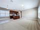 Living room with carpet and an open concept kitchen at 8851 Sperry St, Orlando, FL 32827