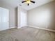 Bedroom with neutral walls, carpet, and double-door closet at 8851 Sperry St, Orlando, FL 32827