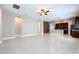 Spacious living room with tile floors and ceiling fan at 8851 Sperry St, Orlando, FL 32827