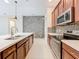 Modern kitchen with stainless steel appliances and a stone backsplash at 8851 Sperry St, Orlando, FL 32827