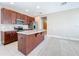 Open concept kitchen with an island and stainless steel appliances at 8851 Sperry St, Orlando, FL 32827