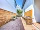 Long and narrow brick patio with outdoor kitchen and wooden wall at 8851 Sperry St, Orlando, FL 32827
