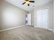 Bedroom with neutral walls, carpet, and door to hallway at 8851 Sperry St, Orlando, FL 32827