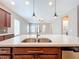 Kitchen island with double sink, overlooking living room at 8851 Sperry St, Orlando, FL 32827