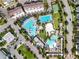 Aerial view of community pool, lap pool, and sand volleyball court at 8851 Sperry St, Orlando, FL 32827