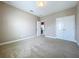 Bedroom with double doors and access to a hallway at 8851 Sperry St, Orlando, FL 32827